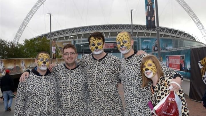 Oct 27, 2013; London, United Kingdom; Jacksonville Jaguars fans (from left) Robert Smallbore and Aaron Devay and Colin Priest and Daniel Brewer and Felicity Brough pose during tailgate festivities before the NFL International Series game against the San Francisco 49ers at Wembley Stadium. Mandatory Credit: Kirby Lee-USA TODAY Sports