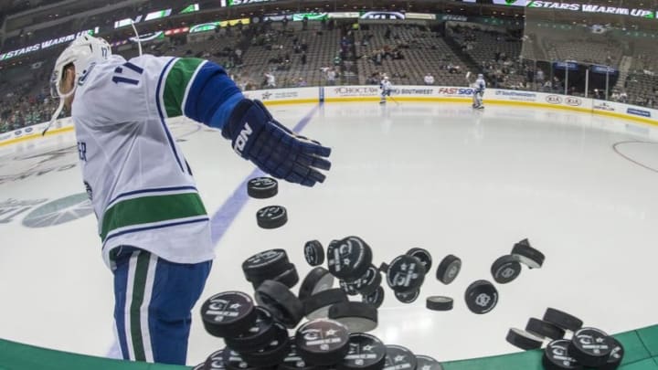 Nov 27, 2015; Dallas, TX, USA; Vancouver Canucks right wing Radim Vrbata (17) throws pucks on the ice prior to the game against the Dallas Stars at the American Airlines Center. Mandatory Credit: Jerome Miron-USA TODAY Sports