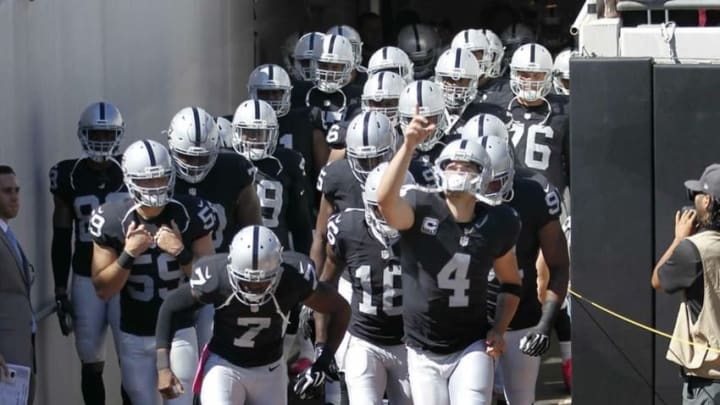 Oct 23, 2016; Jacksonville, FL, USA; The Oakland Raiders emerge from the tunnel led byOakland Raiders quarterback Derek Carr (4) before a football game against the Jacksonville Jaguars at EverBank Field. Mandatory Credit: Reinhold Matay-USA TODAY Sports