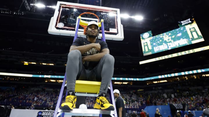 INDIANAPOLIS, INDIANA - APRIL 05: Davion Mitchell #45 of the Baylor Bears sits on a ladder with the trophy after defeating the Gonzaga Bulldogs in the National Championship game of the 2021 NCAA Men's Basketball Tournament at Lucas Oil Stadium on April 05, 2021 in Indianapolis, Indiana. The Baylor Bears defeated the Gonzaga Bulldogs 86-70. (Photo by Tim Nwachukwu/Getty Images)
