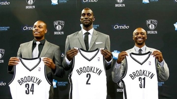 Jul 18, 2013; Brooklyn, NY, USA; From left Paul Pierce , Kevin Garnett and Jason Terry during a press conference to introduce them as the newest members of the Brooklyn Nets at Barclays Center. Mandatory Credit: Debby Wong-USA TODAY Sports