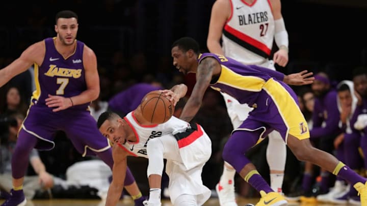 LOS ANGELES, CA - DECEMBER 23: Kentavious Caldwell-Pope #1 and Larry Nance Jr. #7 of the Los Angeles Lakers defend against Evan Turner #1 of the Portland Trail Blazers during the first half of a game at Staples Center on December 23, 2017 in Los Angeles, California. NOTE TO USER: User expressly acknowledges and agrees that, by downloading and or using this photograph, User is consenting to the terms and conditions of the Getty Images License Agreement. (Photo by Sean M. Haffey/Getty Images)