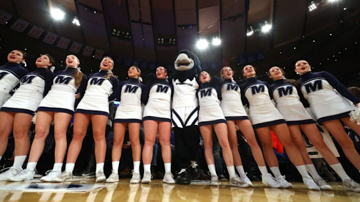 NEW YORK, NY - DECEMBER 09: The Monmouth Hawks cheerleaders and mascot stand after their game against the Kentucky Wildcats at Madison Square Garden on December 9, 2017 in New York City. This photo is part of a photo essay on three sporting events in a fifteen hour time span at Madison Square Garden. The three sports were an NCAA college basketball game between The University of Kentucky vs Monmouth College, followed by an NHL hockey game between the New York Rangers against the New Jersey Devils, followed by a boxing match for the WBO Lightweight Title between Vasiliy Lomachenko against Guillermo Rigondeaux. (Photo by Al Bello/Getty Images)