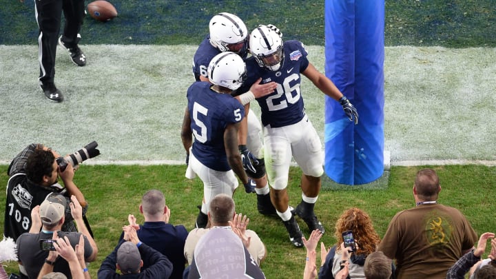 GLENDALE, AZ – DECEMBER 30: Running back Saquon Barkley #26 of the Penn State Nittany Lions celebrates a two yard touchdown with wide receiver DaeSean Hamilton #5 and offensive lineman Connor McGovern #66 during the first half of the PlayStation Fiesta Bowl against the Washington Huskies at University of Phoenix Stadium on December 30, 2017 in Glendale, Arizona. (Photo by Jennifer Stewart/Getty Images)