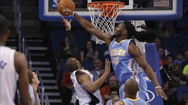 Mar 12, 2014; Orlando, FL, USA; Denver Nuggets forward Kenneth Faried (35) blocks Orlando Magic guard Arron Afflalo (4) shot during the first quarter at Amway Center. Mandatory Credit: Kim Klement-USA TODAY Sports