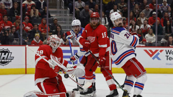 Mar 30, 2022; Detroit, Michigan, USA; Detroit Red Wings goaltender Alex Nedeljkovic (39) makes a save in front of New York Rangers left wing Chris Kreider (20) in the third period at Little Caesars Arena. Mandatory Credit: Rick Osentoski-USA TODAY Sports