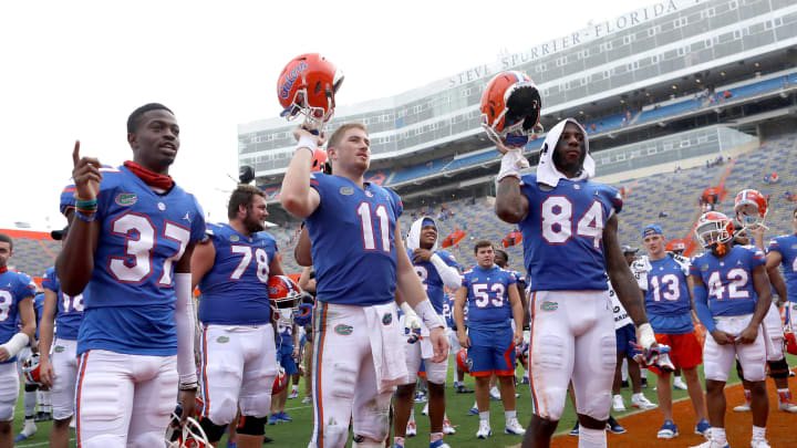 Nov 28, 2020; Gainesville, FL, USA; Florida Gators players including Kyle Trask (11) and Kyle Pitts (84) celebrate with teammates after the Gators beat the Kentucky Wildcats at Ben Hill Griffin Stadium in Gainesville, Fla. Nov. 28, 2020. Mandatory Credit: Brad McClenny-USA TODAY NETWORK
