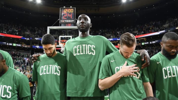 BOSTON, MA - OCTOBER 6: Enes Kanter #11 of the Boston Celtics, Tacko Fall #99 of the Boston Celtics, and Gordon Hayward #20 of the Boston Celtics stands for the national anthem before the game against the Charlotte Hornets on October 6, 2019 at the TD Garden in Boston, Massachusetts. NOTE TO USER: User expressly acknowledges and agrees that, by downloading and or using this photograph, User is consenting to the terms and conditions of the Getty Images License Agreement. Mandatory Copyright Notice: Copyright 2019 NBAE (Photo by Brian Babineau/NBAE via Getty Images)