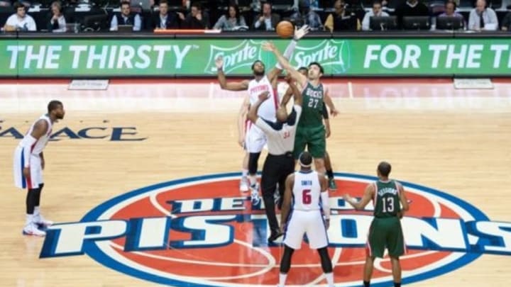 Mar 31, 2014; Auburn Hills, MI, USA; Detroit Pistons center Andre Drummond (0) battles for the ball with Milwaukee Bucks center Zaza Pachulia (27) during the opening tip off at The Palace of Auburn Hills. Mandatory Credit: Tim Fuller-USA TODAY Sports