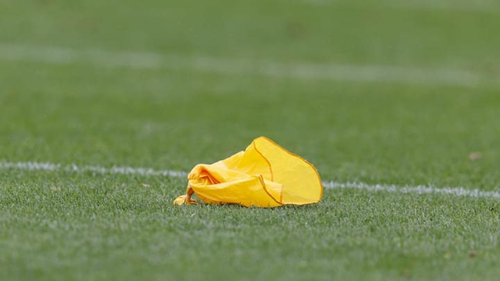 A penalty flag lays on the field. Mandatory Credit: Jeff Hanisch-USA TODAY Sports