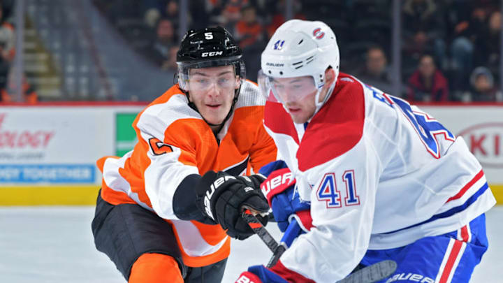 PHILADELPHIA, PA - NOVEMBER 07: Philippe Myers #5 of the Philadelphia Flyers stick checks Paul Byron #41 of the Montreal Canadiens during the third period at Wells Fargo Center on November 7, 2019 in Philadelphia, Pennsylvania. The Flyers won 3-2 in overtime. (Photo by Drew Hallowell/Getty Images)