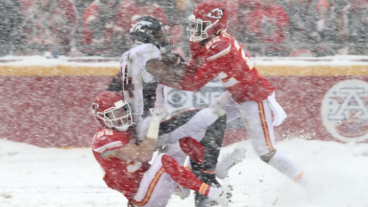 KANSAS CITY, MISSOURI – DECEMBER 15: Courtland Sutton #14 of the Denver Broncos is tackled by Ben Niemann #56 and Juan Thornhill #22 of the Kansas City Chiefs in the game at Arrowhead Stadium on December 15, 2019 in Kansas City, Missouri. (Photo by Jamie Squire/Getty Images)