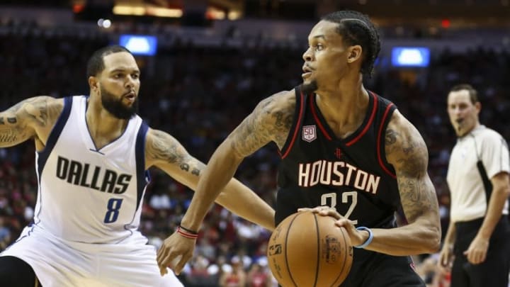 Oct 30, 2016; Houston, TX, USA; Houston Rockets guard K.J. McDaniels (32) dribbles the ball as Dallas Mavericks guard Deron Williams (8) defends during the second quarter at Toyota Center. Mandatory Credit: Troy Taormina-USA TODAY Sports