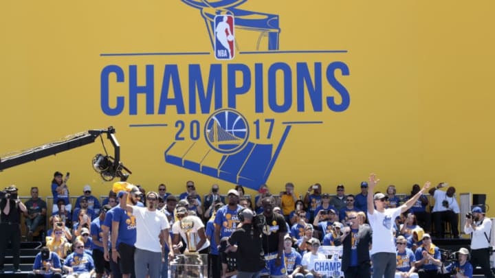 OAKLAND, CA - JUNE 15: The Golden State Warriors celebrates with fans after winning the 2017 NBA Championship during a parade on June 15, 2017 in Oakland, CA. NOTE TO USER: User expressly acknowledges and agrees that, by downloading and/or using this Photograph, user is consenting to the terms and conditions of the Getty Images License Agreement. Mandatory Copyright Notice: Copyright 2017 NBAE (Photo by Jack Arent/NBAE via Getty Images)