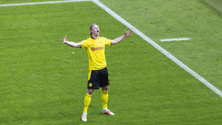 BERLIN, GERMANY - MAY 13: Erling Haaland of Dortmund celebrates scoring the 2:0 goal during the DFB Cup final match between RB Leipzig and Borussia Dortmund at Olympic Stadium on May 13, 2021 in Berlin, Germany. Sporting stadiums around Germany remain under strict restrictions due to the Coronavirus Pandemic as Government social distancing laws prohibit fans inside venues resulting in games being played behind closed doors. (Photo by Mika Volkmann/Getty Images)