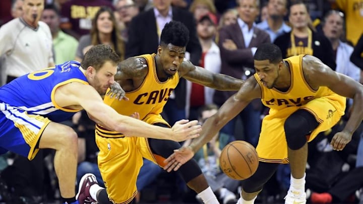 Jun 11, 2015; Cleveland, OH, USA; Cleveland Cavaliers guard Iman Shumpert (4) and center Tristan Thompson (13) go after a loose ball against Golden State Warriors forward David Lee (10)during the third quarter in game four of the NBA Finals at Quicken Loans Arena. Mandatory Credit: Bob Donnan-USA TODAY Sports