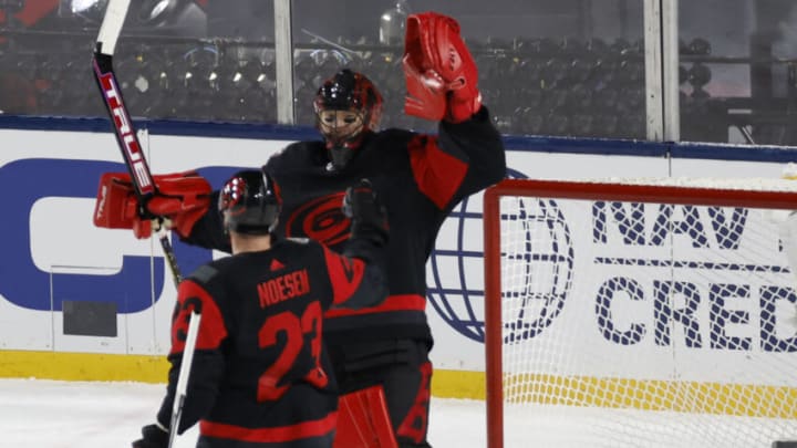 Feb 18, 2023; Raleigh, North Carolina, USA; Carolina Hurricanes goaltender Frederik Andersen (31) celebrates with Hurricanes right wing Stefan Noesen (23) after their game against the Washington Capitals in the 2023 Stadium Series ice hockey game at Carter-Finley Stadium. Mandatory Credit: Geoff Burke-USA TODAY Sports