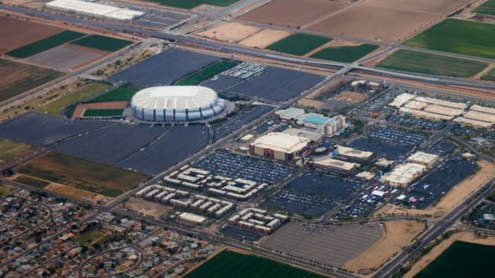 Apr 10, 2016; Glendale, AZ, USA; Aerial view of University of Phoenix Stadium (left), home of the Arizona Cardinals NFL football team. Also visible is the Gila River Arena in the Westgate Entertainment District , home of the Arizona Coyotes NHL hockey team. Mandatory Credit: Mark J. Rebilas-USA TODAY Sports