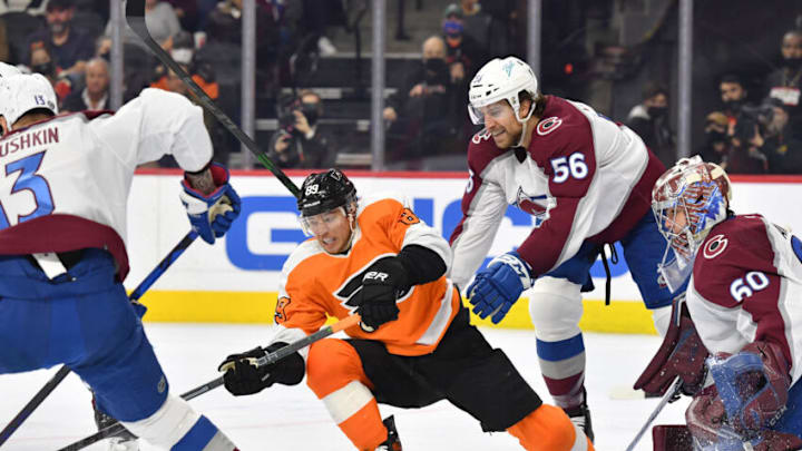 Dec 6, 2021; Philadelphia, Pennsylvania, USA; Philadelphia Flyers right wing Cam Atkinson (89) and Colorado Avalanche defenseman Kurtis MacDermid (56) battle for the puck during the third period at Wells Fargo Center. Mandatory Credit: Eric Hartline-USA TODAY Sports