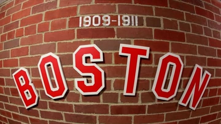 April 20, 2012; Boston, MA, USA; Historical logos on display under the grandstands during the 100th anniversary celebration at Fenway Park. Mandatory Credit: Greg M. Cooper-USA TODAY Sports