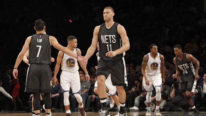 Dec 22, 2016; Brooklyn, NY, USA; Brooklyn Nets guard Jeremy Lin (7) reacts with center Brook Lopez (11) in the second quarter against Golden State Warriors at Barclays Center. The Warriors won 117-101. Mandatory Credit: Nicole Sweet-USA TODAY Sports