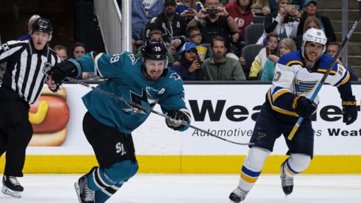 SAN JOSE, CA - MAY 19: San Jose Sharks center Logan Couture (39) out races St. Louis Blues center Brayden Schenn (10) for the puck control during the 5th game of the Western Conference Final between the St. Louis Blues and the San Jose Sharks on Sunday, May 19, 2019 at the SAP Center in San Jose, California.(Photo by Douglas Stringer/Icon Sportswire via Getty Images)