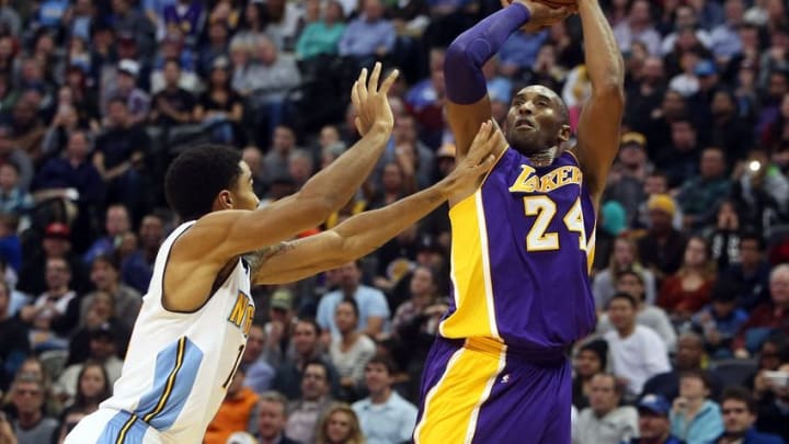 Dec 22, 2015; Denver, CO, USA; Los Angeles Lakers forward Kobe Bryant (24) shoots the ball against Denver Nuggets guard Gary Harris (14) during the second half at Pepsi Center. The Lakers won 111-107. Mandatory Credit: Chris Humphreys-USA TODAY Sports