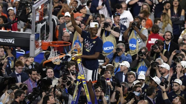 MINNEAPOLIS, MINNESOTA - APRIL 08: Mamadi Diakite #25 of the Virginia Cavaliers cuts down the net after his teams 85-77 win over the Texas Tech Red Raiders in the 2019 NCAA men's Final Four National Championship game at U.S. Bank Stadium on April 08, 2019 in Minneapolis, Minnesota. (Photo by Hannah Foslien/Getty Images)