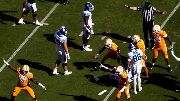 Tennessee defensive players signal a fumble as Tennessee defensive back Bryce Thompson (0) comes out of the pile with the ball during a SEC conference football game between the Tennessee Volunteers and the Kentucky Wildcats held at Neyland Stadium in Knoxville, Tenn., on Saturday, October 17, 2020.Kns Ut Football Kentucky Bp