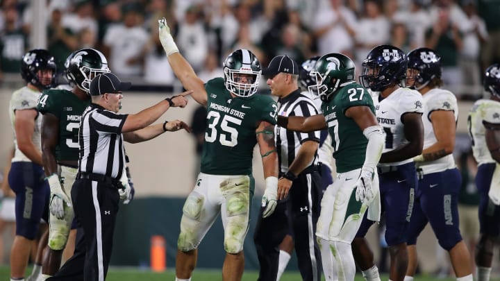 EAST LANSING, MI – AUGUST 31: Joe Bachie #35 of the Michigan State Spartans celebrates a late fourth quarter interception while playing the Utah State Aggies at Spartan Stadium on August 31, 2018 in East Lansing, Michigan. Michigan State won the game 38-31. (Photo by Gregory Shamus/Getty Images)