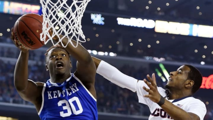 Apr 7, 2014; Arlington, TX, USA; Kentucky Wildcats forward Julius Randle (30) shoots against Connecticut Huskies forward DeAndre Daniels (2) in the second half during the championship game of the Final Four in the 2014 NCAA Mens Division I Championship tournament at AT&T Stadium. Mandatory Credit: Robert Deutsch-USA TODAY Sports