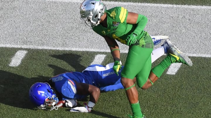 LAS VEGAS, NV – DECEMBER 16: Wide receiver A.J. Richardson #7 of the Boise State Broncos misses a pass under pressure from cornerback Thomas Graham Jr. #4 of the Oregon Ducks during the first half of the Las Vegas Bowl at Sam Boyd Stadium on December 16, 2017 in Las Vegas, Nevada. Boise State won 38-28. (Photo by Ethan Miller/Getty Images)