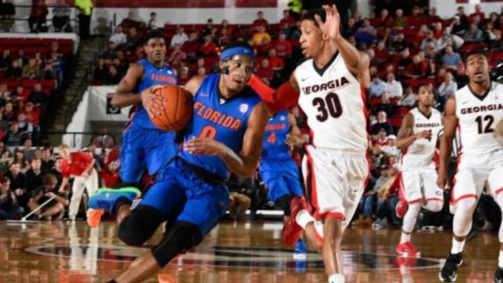 Feb 16, 2016; Athens, GA, USA; Florida Gators guard Kasey Hill (0) drives the ball past Georgia Bulldogs guard J.J. Frazier (30) during the first half at Stegeman Coliseum. Florida defeated Georgia 57-53. Mandatory Credit: Dale Zanine-USA TODAY Sports
