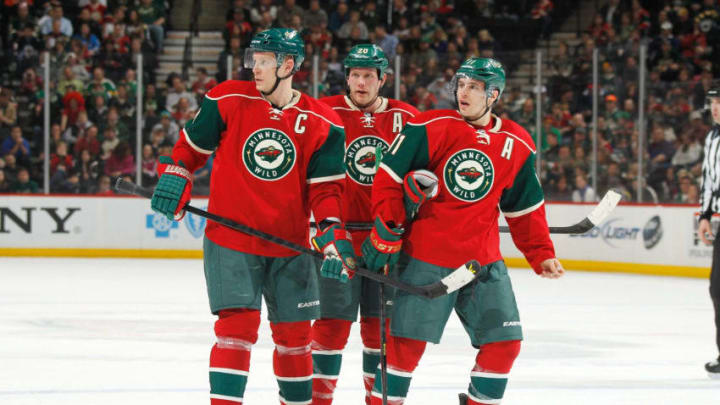 ST. PAUL, MN - MARCH 27: (L-R) Mikko Koivu #9, Ryan Suter #20, and Zach Parise #11 of the Minnesota Wild talk during a break in the game against the Phoenix Coyotes on March 27, 2013 at the Xcel Energy Center in Saint Paul, Minnesota. (Photo by Bruce Kluckhohn/NHLI via Getty Images)
