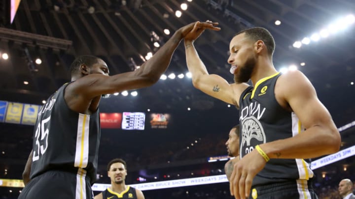 OAKLAND, CA - JUNE 03: Stephen Curry #30 of the Golden State Warriors celebrates with Kevin Durant #35 against the Cleveland Cavaliers during the first quarter in Game 2 of the 2018 NBA Finals at ORACLE Arena on June 3, 2018 in Oakland, California. NOTE TO USER: User expressly acknowledges and agrees that, by downloading and or using this photograph, User is consenting to the terms and conditions of the Getty Images License Agreement. (Photo by Ezra Shaw/Getty Images)