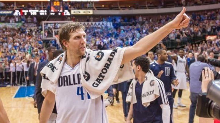 Apr 12, 2014; Dallas, TX, USA; Dallas Mavericks forward Dirk Nowitzki (41) and his team celebrate the win over the Phoenix Suns at the American Airlines Center. The Mavericks defeated the Suns 101-98 and clinched a spot in the NBA playoffs. Mandatory Credit: Jerome Miron-USA TODAY Sports