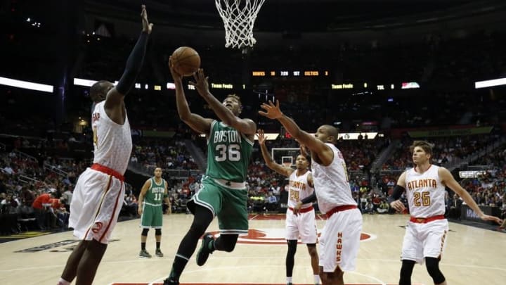 Apr 19, 2016; Atlanta, GA, USA; Boston Celtics guard Marcus Smart (36) attempts a shot against Atlanta Hawks forward Paul Millsap (4) and center Al Horford (15) in the first quarter of game two of the first round of the NBA Playoffs at Philips Arena. Mandatory Credit: Jason Getz-USA TODAY Sports