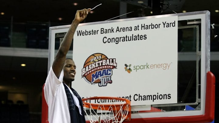 BRIDGEPORT, CT - MARCH 07: Jeron Belin #5 of the St. Peter's Peacocks celebrates by cutting down a piece of the net after St. Peter's Peacocks won 62-57 against the Iona Gaels during the final of the MAAC men's conference basketball tournment at Webster Bank Arena at Harbor Yard on March 7, 2011 in Bridgeport, Connecticut. (Photo by Chris Chambers/Getty Images)