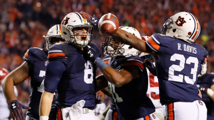 AUBURN, AL - NOVEMBER 25: Jarrett Stidham No. 8 of the Auburn Tigers celebrates with teammates after rushing for a touchdown against the Alabama Crimson Tide at Jordan Hare Stadium on November 25, 2017 in Auburn, Alabama. (Photo by Kevin C. Cox/Getty Images)