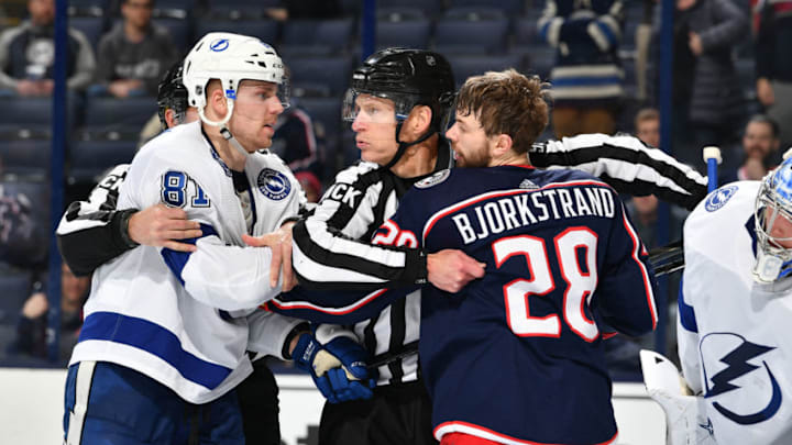 COLUMBUS, OH - FEBRUARY 18: Linesmen Brian Murphy #93 breaks up a scrum between Erik Cernak #81 of the Tampa Bay Lightning and Oliver Bjorkstrand #28 of the Columbus Blue Jackets during the third period of a game on February 18, 2019 at Nationwide Arena in Columbus, Ohio. (Photo by Jamie Sabau/NHLI via Getty Images)