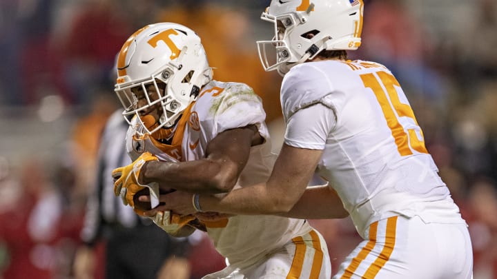 FAYETTEVILLE, AR – NOVEMBER 7: Harrison Bailey #15 hands off the ball to Eric Gray #3 of the Tennessee Volunteers during a game against the Arkansas Razorbacks at Razorback Stadium on November 7, 2020 in Fayetteville, Arkansas. The Razorbacks defeated the Volunteers 24-13. (Photo by Wesley Hitt/Getty Images)