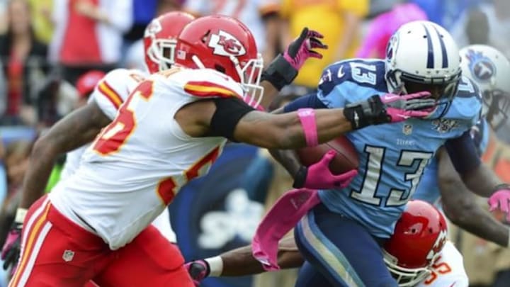 Oct 6, 2013; Nashville, TN, USA; Tennessee Titans wide receiver Kendall Wright (13) runs with the ball against Kansas City Chiefs linebacker Derrick Johnson (56) during the second half at LP Field. The Chiefs beat the Titans 26-17. Mandatory Credit: Don McPeak-USA TODAY Sports