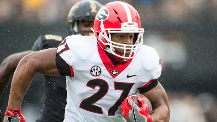 NASHVILLE, TN - OCTOBER 07: Running back Nick Chubb #27 of the Georgia Bulldogs carries the ball during a game against the Vanderbilt Commodores at Vanderbilt Stadium on October 7, 2017 in Nashville, Tennessee. (Photo by Ronald C. Modra/Sports Imagery/Getty Images)