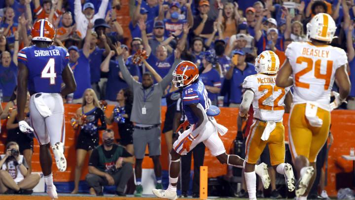 Sep 25, 2021; Gainesville, Florida, USA; Florida Gators wide receiver Rick Wells (12) runs the ball in for a touchdown against the Tennessee Volunteers during the third quarter at Ben Hill Griffin Stadium. Mandatory Credit: Kim Klement-USA TODAY Sports