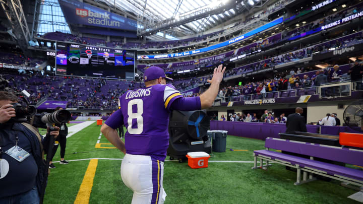 MINNEAPOLIS, MINNESOTA – JANUARY 09: Kirk Cousins #8 of the Minnesota Vikings waves to fans as he leaves the field after a 31-17 win over the Chicago Bears at U.S. Bank Stadium on January 09, 2022 in Minneapolis, Minnesota. (Photo by Adam Bettcher/Getty Images)