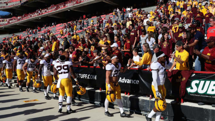 COLLEGE PARK, MD - OCTOBER 15: Members of the Minnesota Golden Gophers celebrate with fans following their 31-10 win over the Maryland Terrapins at Capital One Field on October 15, 2016 in College Park, Maryland. (Photo by Rob Carr/Getty Images)