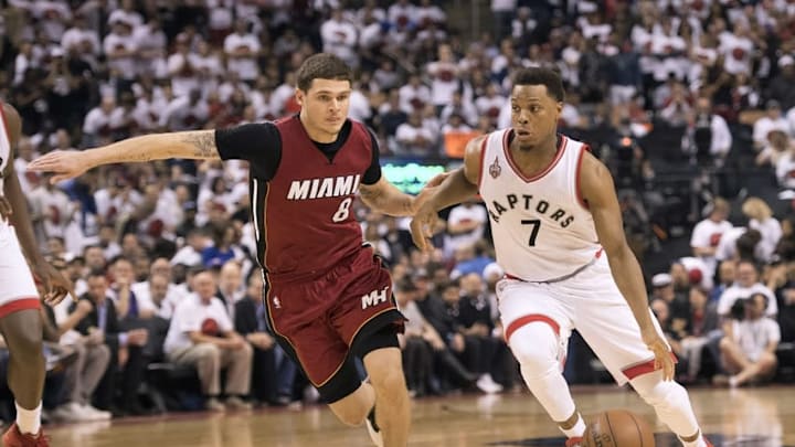 May 15, 2016; Toronto, Ontario, CAN; Toronto Raptors guard Kyle Lowry (7) drives the ball defended by Miami Heat guard Tyler Johnson (8) during the fourth quarter in game seven of the second round of the NBA Playoffs at Air Canada Centre. The Toronto Raptors won 116-89. Mandatory Credit: Nick Turchiaro-USA TODAY Sports