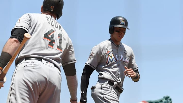 SAN FRANCISCO, CA - JULY 09: Christian Yelich #21 of the Miami Marlins is congratulated by Justin Bour #41 after Yelich scored against the San Francisco Giants in the top of the third inning at AT&T Park on July 9, 2017 in San Francisco, California. (Photo by Thearon W. Henderson/Getty Images)