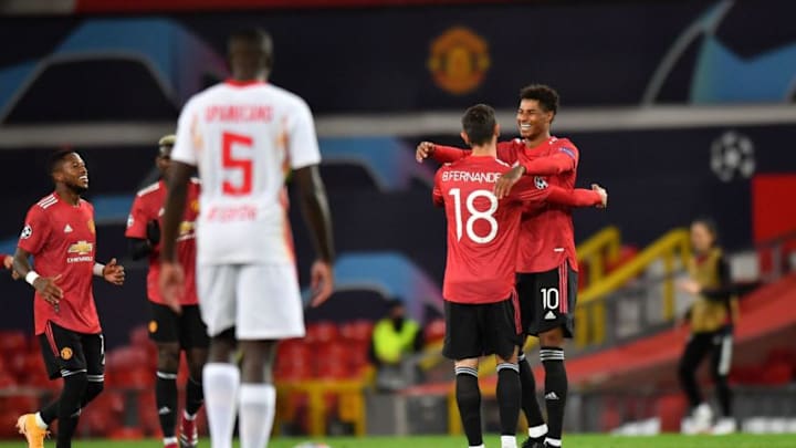 Manchester United's English striker Marcus Rashford (R) celebrates scoring his team's third goal, his second, with Manchester United's Portuguese midfielder Bruno Fernandes, during the UEFA Champions league group H football match between Manchester United and RB Leipzig at Old Trafford stadium in Manchester, north west England, on October 28, 2020. (Photo by Anthony Devlin / AFP) (Photo by ANTHONY DEVLIN/AFP via Getty Images)