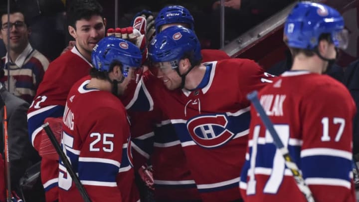 MONTREAL, QC - APRIL 06: Max Domi #13 of the Montreal Canadiens (R) congratulates Ryan Poehling #25 for his first career NHL goal in his first game at 11:41 of the first period against the Toronto Maple Leafs at the Bell Centre on April 6, 2019 in Montreal, Quebec, Canada. The Montreal Canadiens defeated the Toronto Maple Leafs 6-5 in a shootout. (Photo by Minas Panagiotakis/Getty Images)
